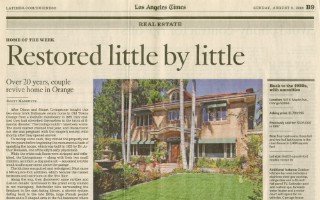 Newspaper article “Restored little by little” with a photograph of a restored home.