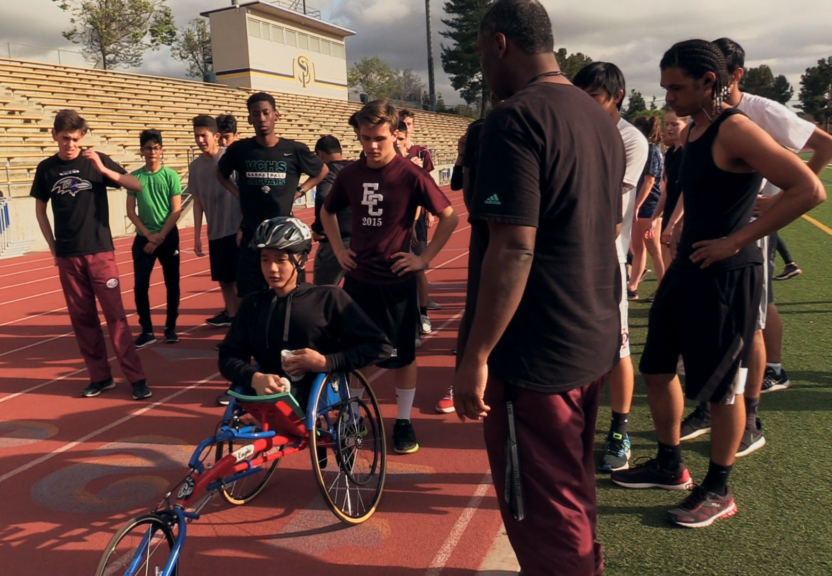 Let ’Em Play – Michael Seo Racing Michael Seo competing on a running track in a racing wheelchair.